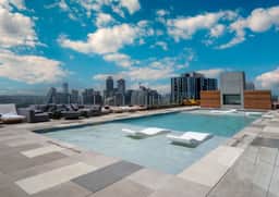 Luxury Rainey Condo • Pool & Gym • Walk to Bars
